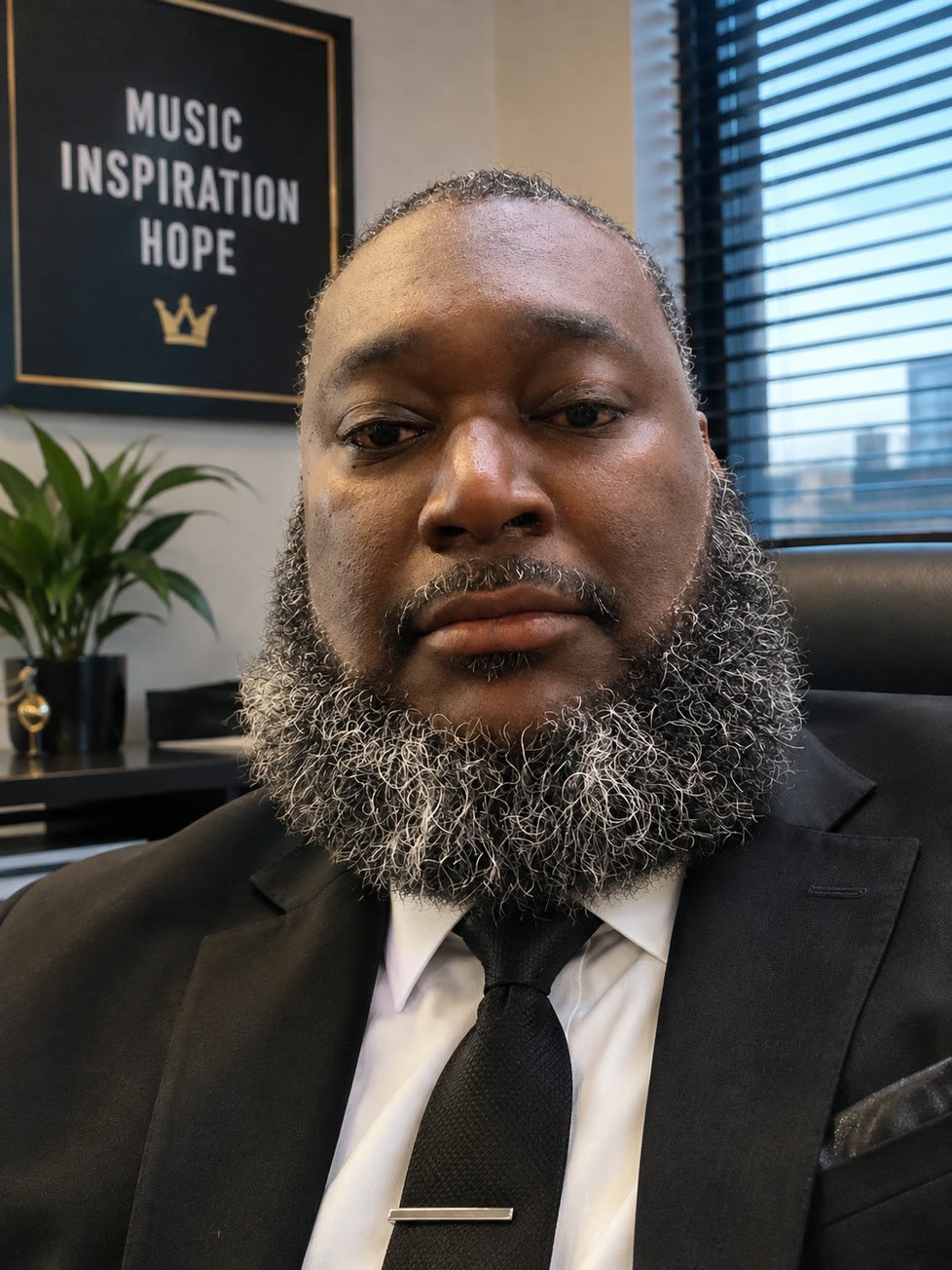 Big Chaplin in a suit at his office